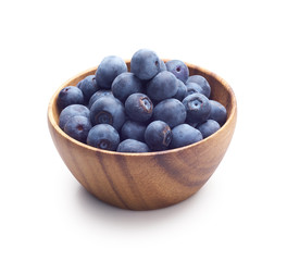Wall Mural - Wooden bowl filled with blueberry