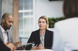 © ReeldealHD images - Senior female business executive leading a corporate meeting