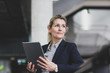 © ReeldealHD images - Senior female business executive using digital tablet in a corporate office