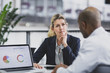 © ReeldealHD images - Senior female business executive listening to an employee in a meeting