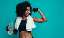 Fitness Woman Flexing Muscles