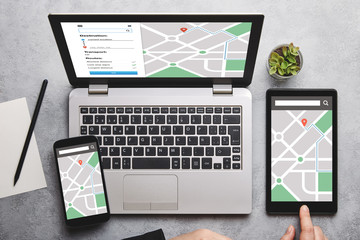 Location tracker concept on laptop, tablet and smartphone screen