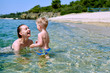© haveseen - Toddler boy on beach with mother