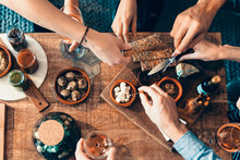 High Angle View Of Hands Picking Up Food From A Table: Togetherness, Friendship, Appetizer, Aperitif, Tapas Moment Concept