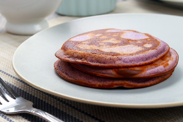 Wall Mural - Delicious dessert. Pancakes with purple jam. Ube Pancakes.