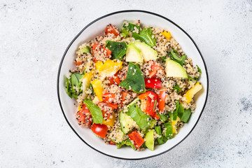 Wall Mural - Quinoa salad with fresh vegetables on white.