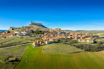 Wall Mural - Atienza aerial panorama with blue sky of medieval ruined castle and town with city walls in Castille and Leon Spain