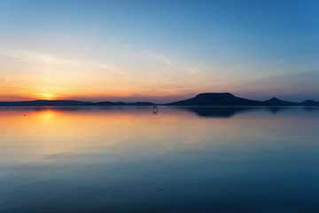 Canvas Print - Lake Balaton after sunset with the Badacsony mountains in the background