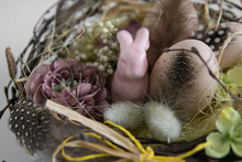 Small Pink Easter Bunny In Basket With Eggs And Easter Decorations