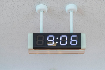 Digital clock hanging on the ceiling at the airport