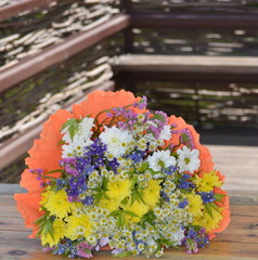 bouquet in summer color on a light wooden background