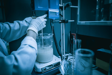 Asian scientist working in the lab,Experiment for customer,Using the formula, the physics and chemistry to calculate the value of the experiment,Thailand people