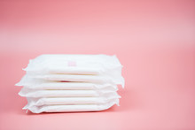 Stacked Sanitary Napkin Pad On Pink Background.