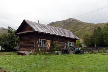 Old tractor T-40 in the village yard of the village Chineta Altai Krai