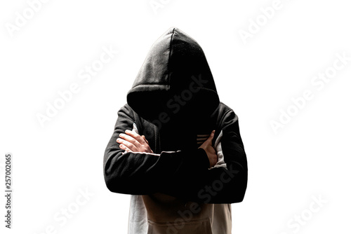 Fotografía anonymous man in the dark hood standing in the mysterious pose f
