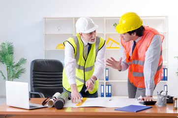 Two engineers colleagues working under project