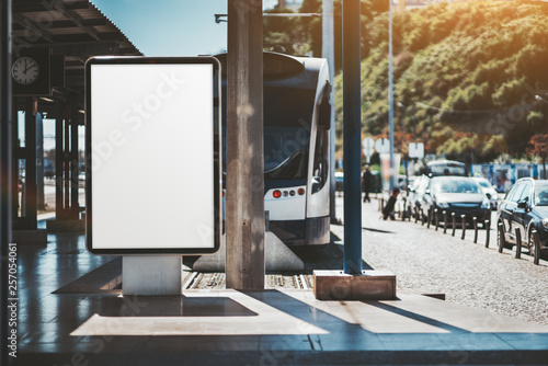 Download A Vertical Empty Poster Mockup In An Outdoor Train Station Depot A Blank Advert Banner Template