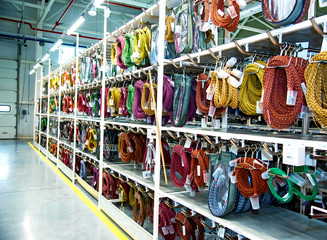 Wall Mural - Industrial landscape with shelves of colored wire ropes at a modern plant for the production of wiring for automobiles. Logistics