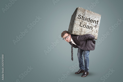 Fotomural Concept of a man in a suit bending under the burden of a student loan