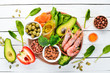 Healthy diet food: spinach, parsley, shrimp, pumpkin seeds, eggs, avocados, broccoli. Top view.