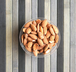 Healthy food  for background image close up almond nuts. Texture Nuts on the cup plate