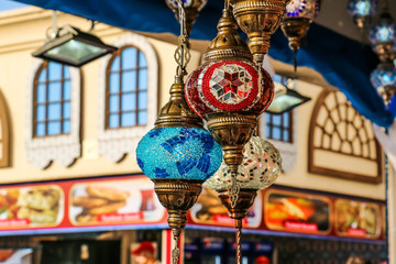 Wall Mural - Traditional bright decorative hanging Turkish lamps and colourful lights with vivid colours  in the Istanbul Bazaar, Turkey