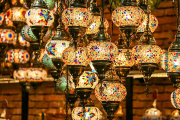 Wall Mural - Traditional bright decorative hanging Turkish lamps and colourful lights with vivid colours  in the Istanbul Bazaar, Turkey