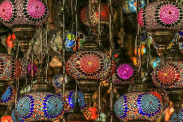 Wall Mural - Traditional bright decorative hanging Turkish lamps and colourful lights with vivid colours  in the Istanbul Bazaar, Turkey