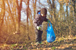 © Daniel CHETRONI - Recycle waste litter rubbish garbage trash junk clean training. Nature cleaning, volunteer ecology green concept. Young men and boys pick up spring forest at sunset. Environment plastic pollution