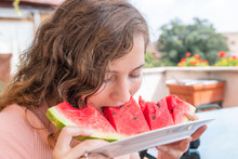 Young Woman In White Summer Smiling Eating Vibrant Colorful Red Watermelon Slice Outside In Italy Villa Sunny Sunlight