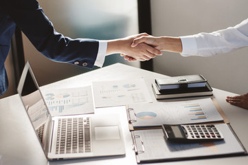 Teamwork and cooperate concept, Business people negotiation shaking hands in a modern office.