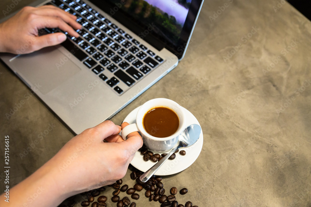 Stock-Foto „Espresso coffee in a cup and coffee beans,woman hands is ...