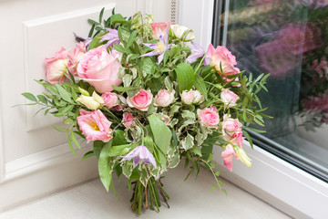 Wall Mural - Wedding bouquet is at the window. Bouquet of pink flowers