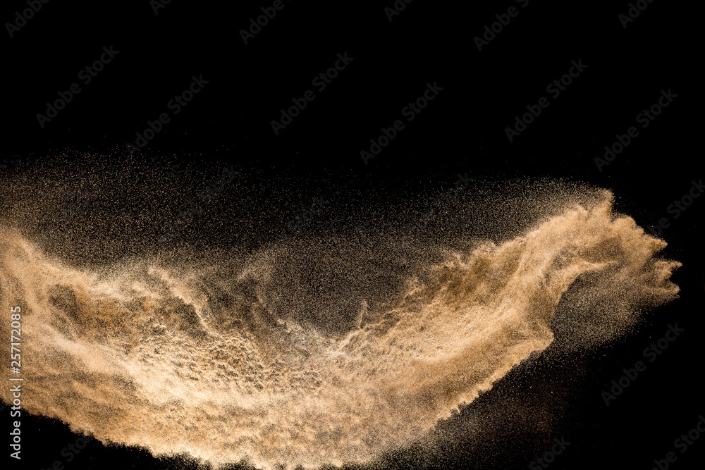 Golden dry river sand explosion isolated on white background. Abstract sand splashing. - obrazy, fototapety, plakaty 