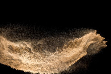 Wall Mural - Golden dry river sand explosion isolated on white background. Abstract sand splashing.
