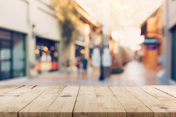 Wall Mural - Empty wood table and Vintage tone blurred defocused of crowd people in walking street festival and shopping mall.