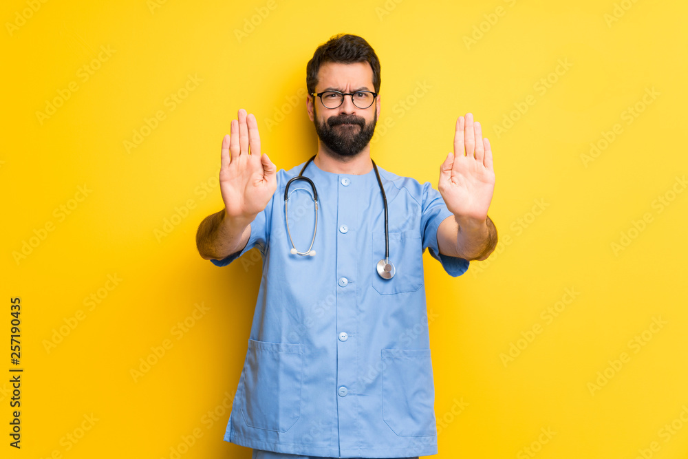 Obraz Surgeon doctor man making stop gesture for disappointed with an opinion fototapeta, plakat