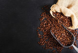 Fototapeta Kuchnia - coffee beans in a sack, top view