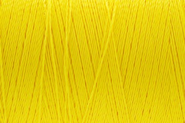Wall Mural - Macro picture of thread texture yellow color background