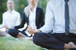 © alotofpeople - Business people practicing yoga