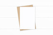 © Phoebe Yu - Flat lay top view elegant white composition letter kraft paper envelope on wooden background