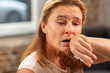 © zinkevych - Woman having running nose and cough suffering from allergy