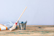 © STOATPHOTO - Metal bucket, money and broom. Cleaning and service symbol or money laundering concept