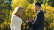 © motortion - Surprise proposal in fall park, excited couple, engagement with ring, happiness