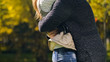 © motortion - Woman and man embracing in autumn park, meeting after long time parting, love