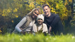 © motortion - Traditional family on picnic in park smiling and looking at camera, insurance