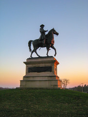 Gorgeous sunset silhouetting the statue of Union Major General Winfield Scott Hancock at Gettysburg National Park in Pennsylvania (USA).