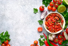 Tomato Salsa (salsa Roja) - Traditional Mexican Sauce  With Ingredients For Making On A Light Grey Slate,stone Or Concrete Background.Top View With Copy Space.