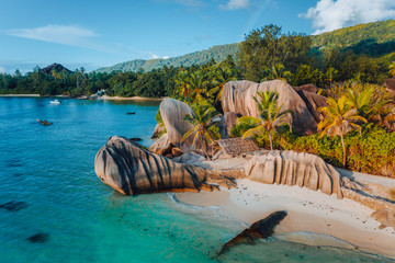 Anse Source D Argent beach, Seychelles. Aerial drone photo of unique tropical island landscape at warm sunset light