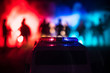 © zef art - Police cars at night. Police car chasing a car at night with fog background. 911 Emergency response pSelective focus
